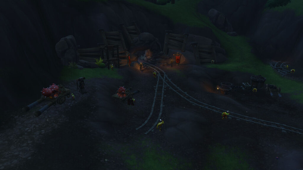 WoW orcs lay rails at the entrance to the mine